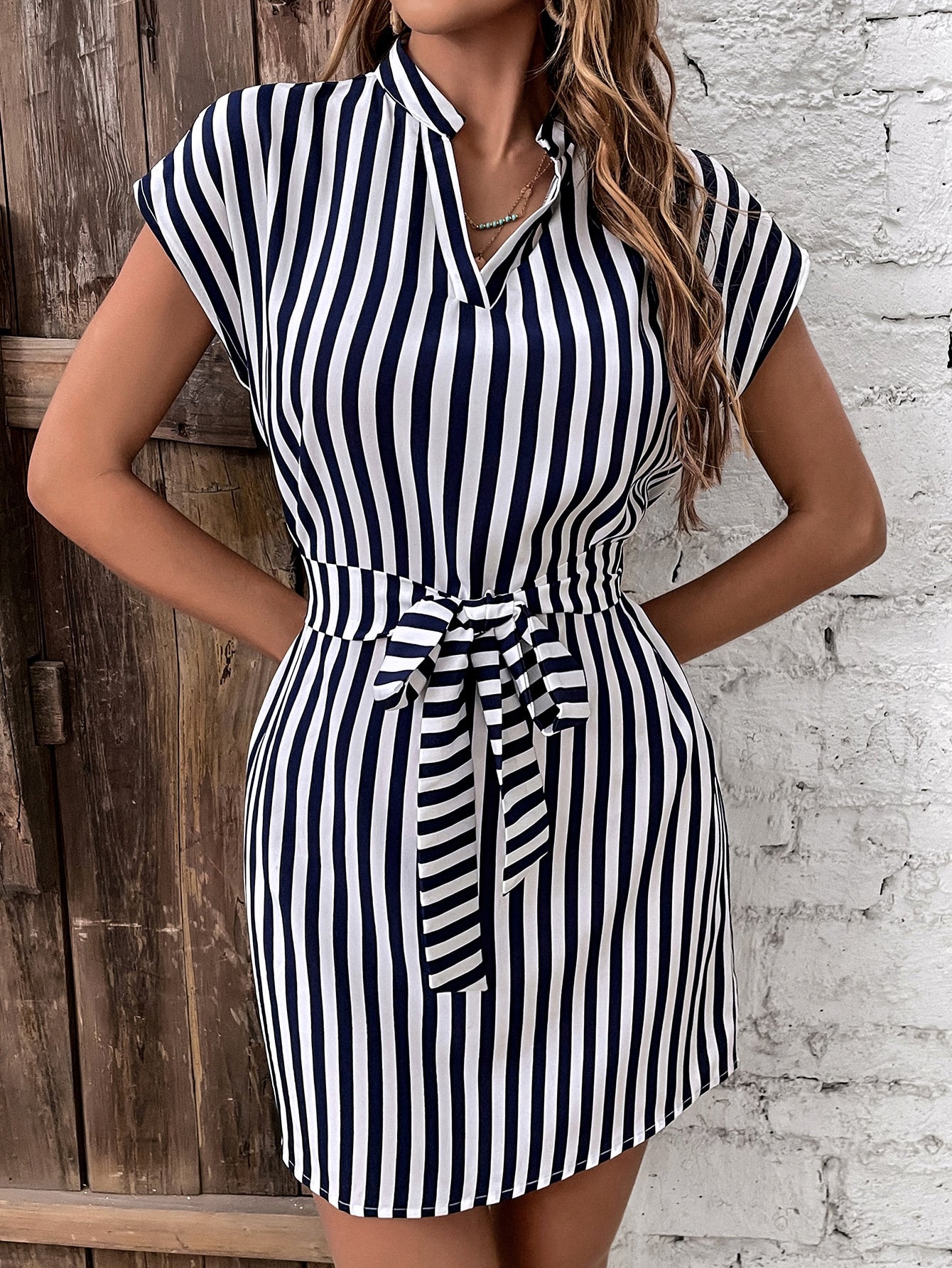 Dress with striped print belt